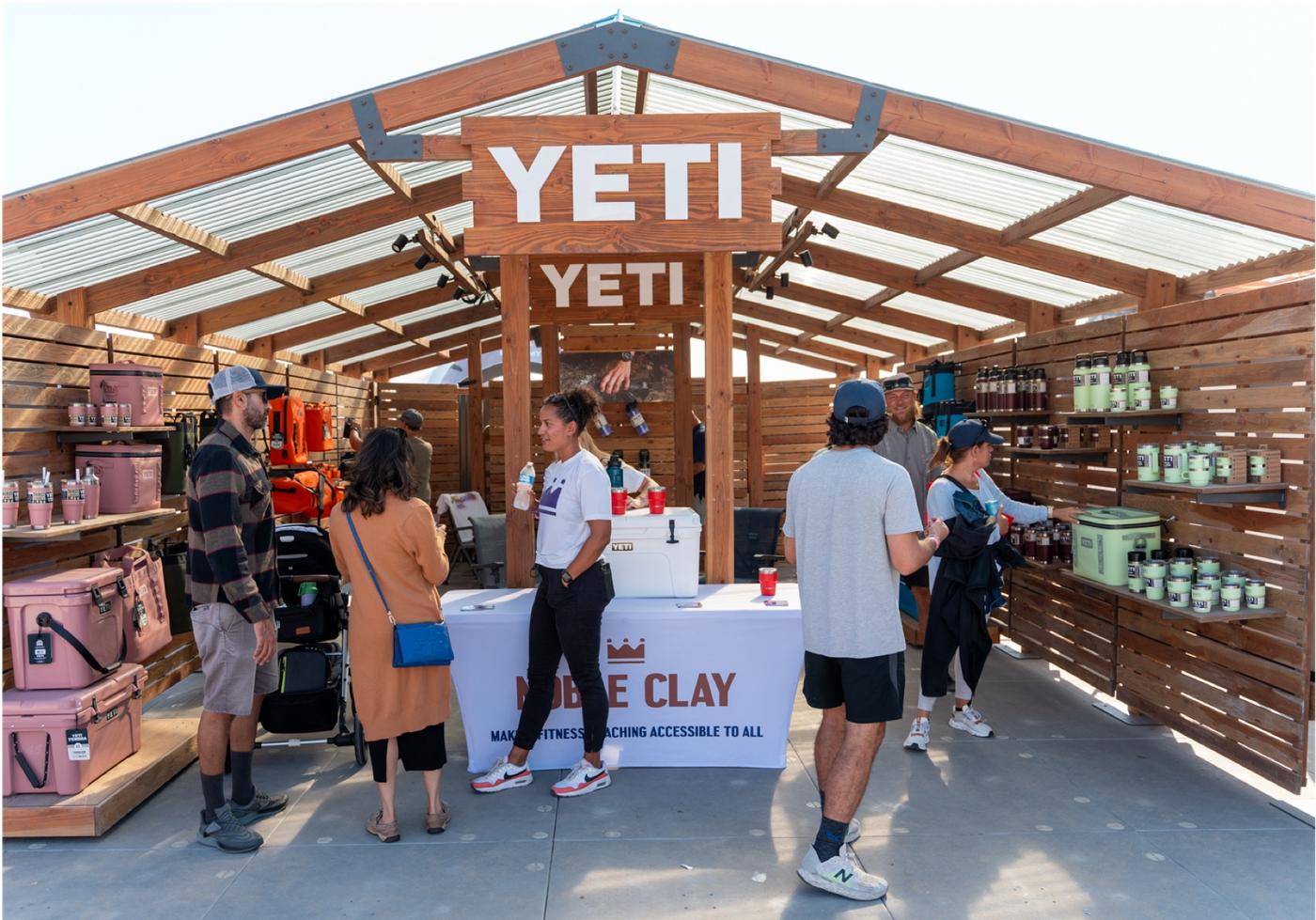 Shoppers inside a branded booth