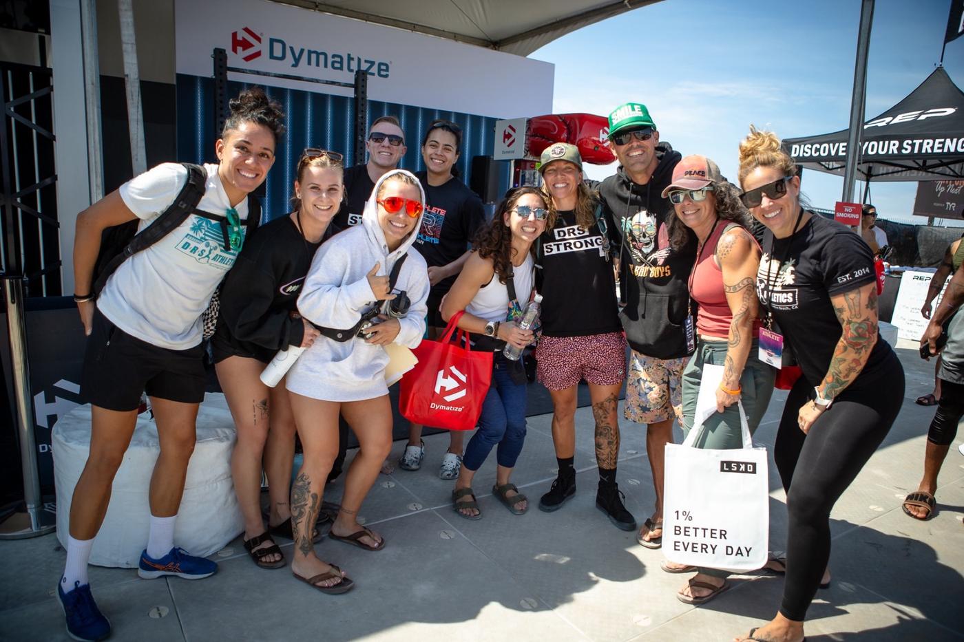 Fans posing with branded bags