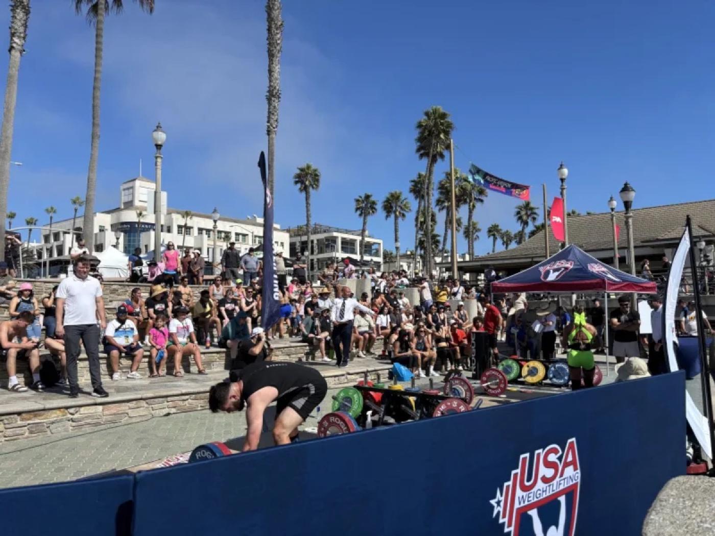 Olympic lifting in front of a packed crowd